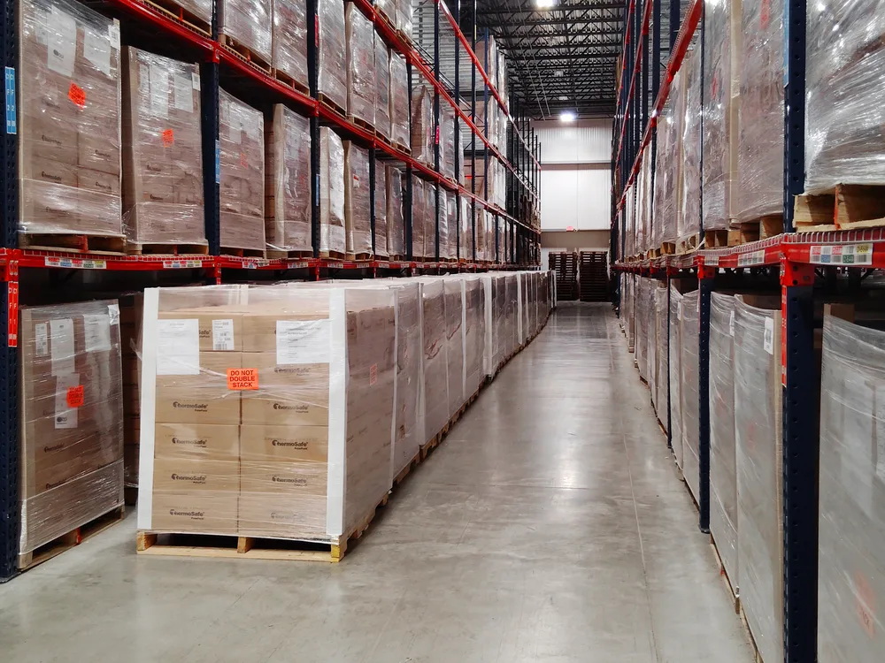 Cartoned product on pallets in the racked aisle of the refrigerated storage hall at the Louisville facility